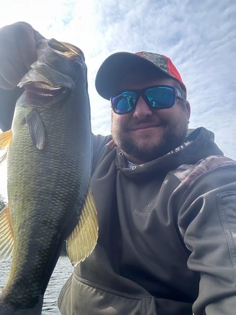 Eddie Bosas Jr. holding a largemouth bass