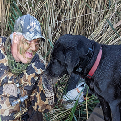 Jack Ammerman duck hunting with his retriever
