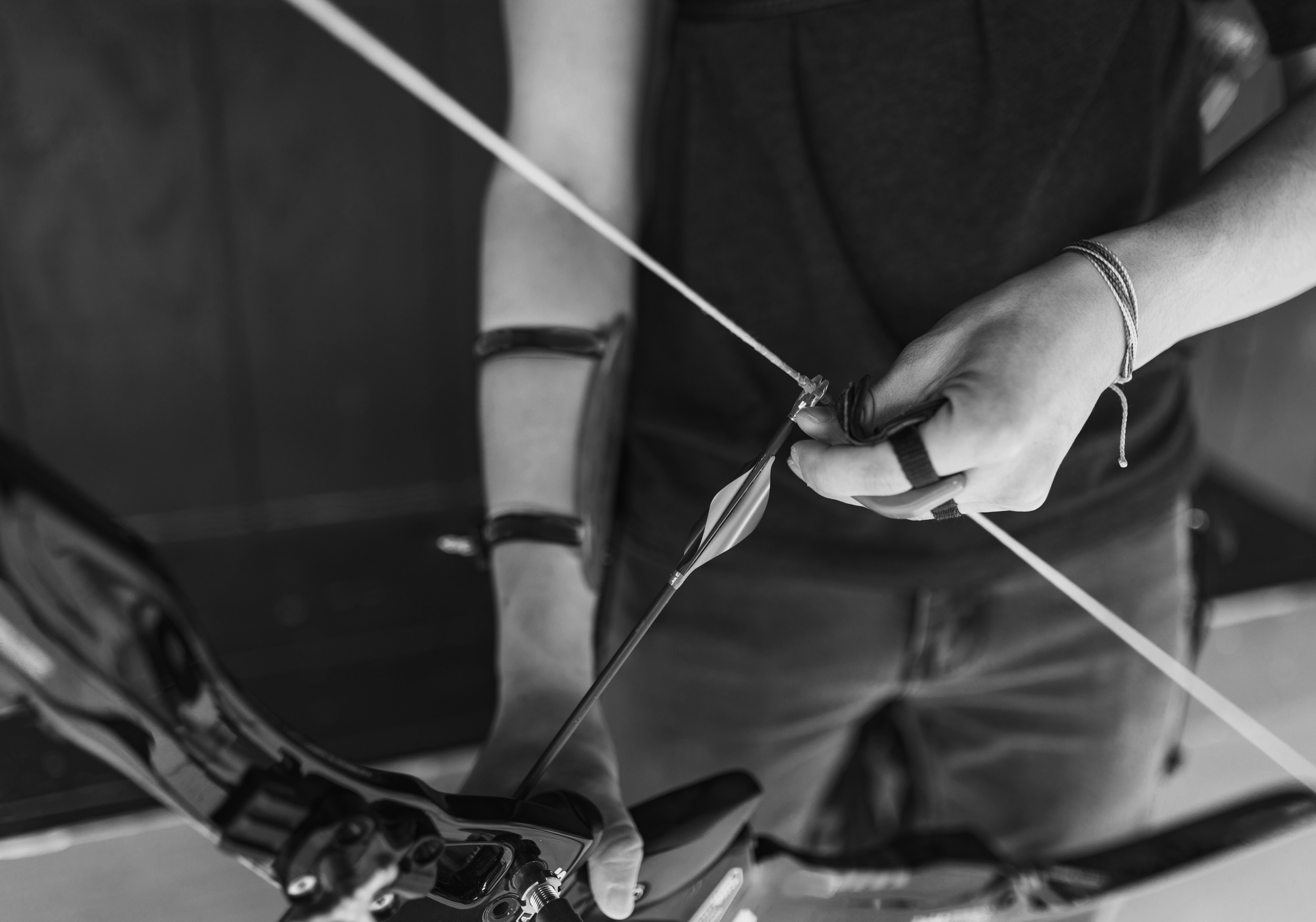 a young man holding a recurve bow