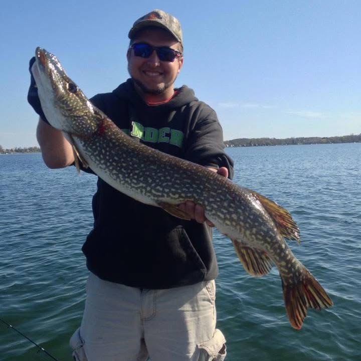 Angler Eddie Bosas Jr. holding a large Northern Pike from Walled Lake.